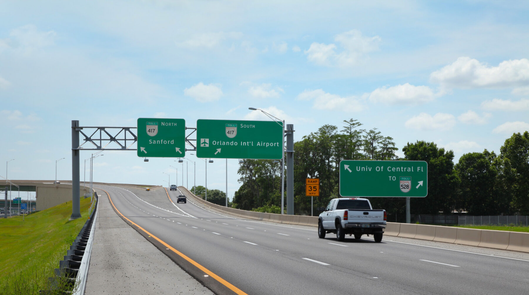 State Road 417 exchange splits North to Sanford, South to Orlando International Airport