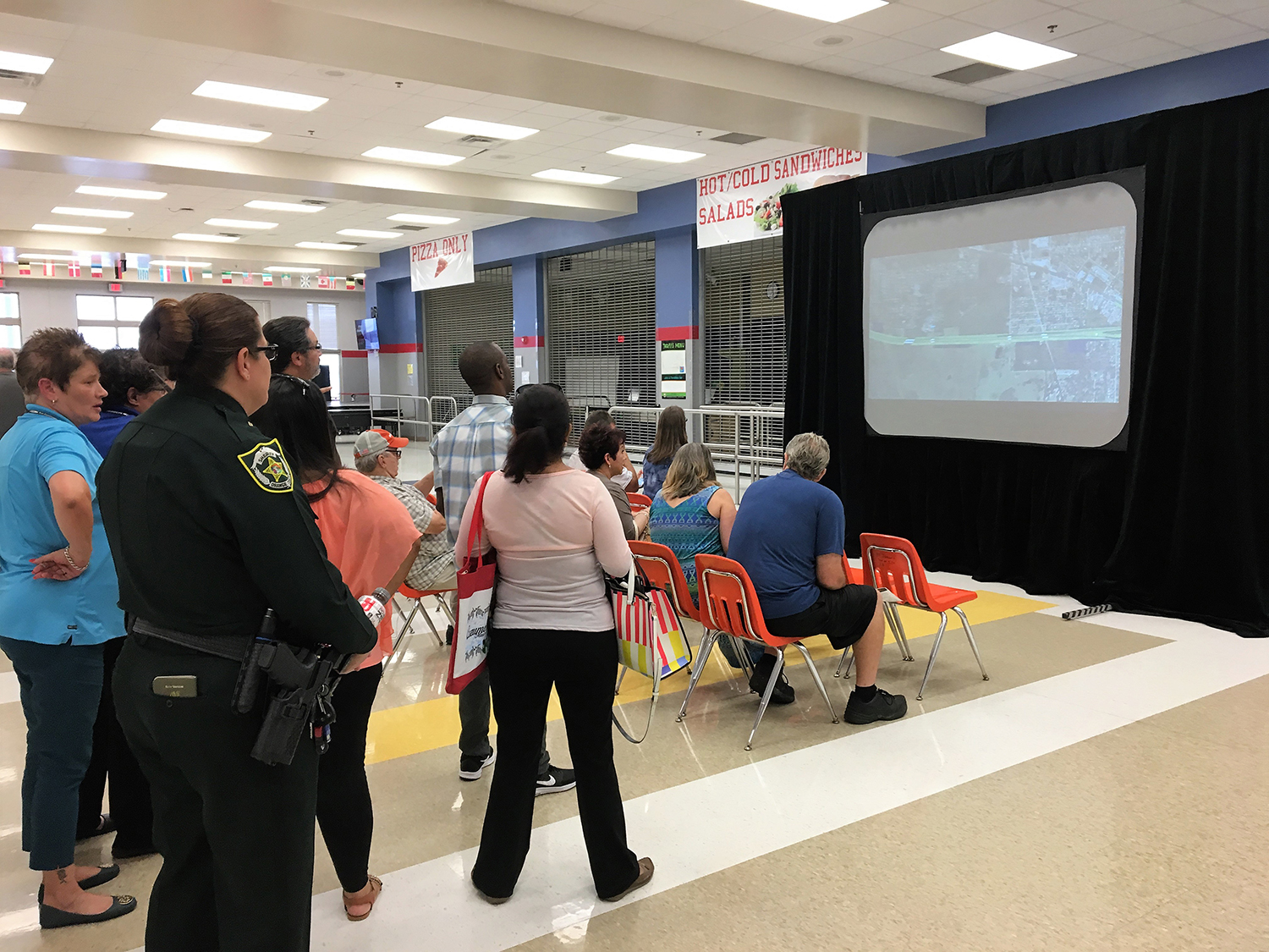 Citizens attend a presentation of the PD&E Study for State Road 408 Eastern Extension during a public meeting