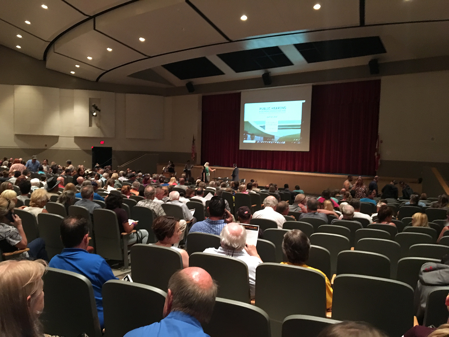 Citizens attend a public meeting regarding the PD&E study of State Road 408 Eastern Extension