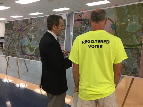 Registed voters examine map plans at Osceola Parkway Extension Public Meeting