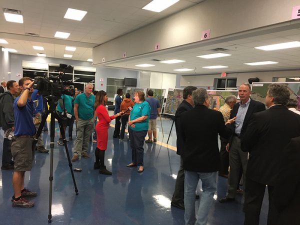 Citizens interviewed by local news crew during Osceola Parkway Extension Public Meeting