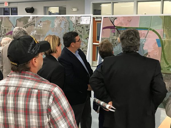 Citizens examine maps at Osceola Parkway Extension Public Meeting