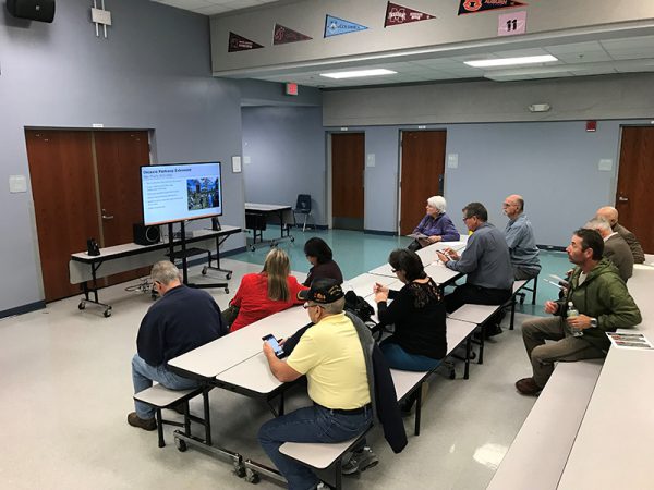 Citizens watch presentation at Osceola Parkway Extension Public Meeting