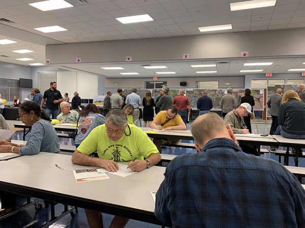 Citizens making notes at Osceola Parkway Extension Public Meeting